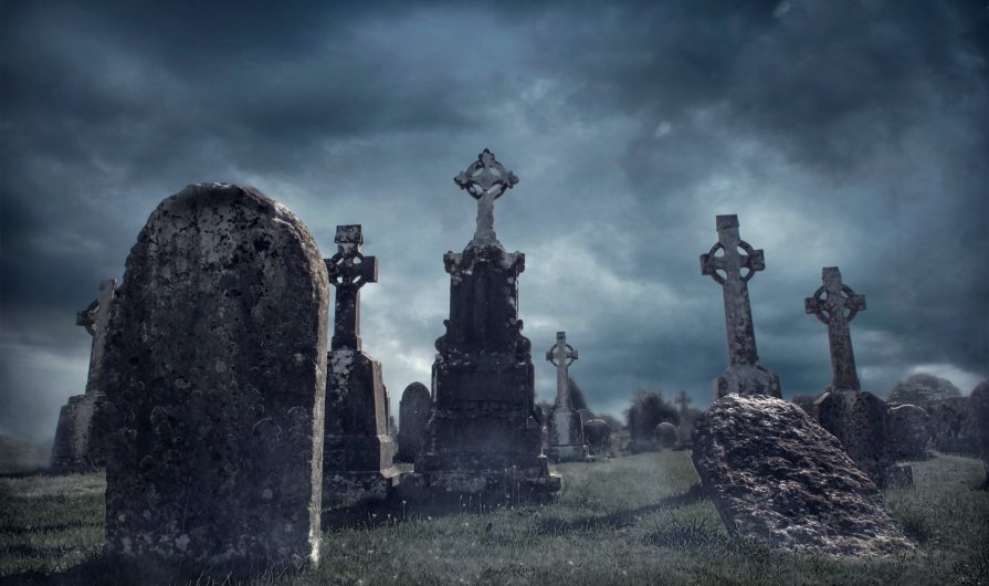 Spooky old graveyard at night